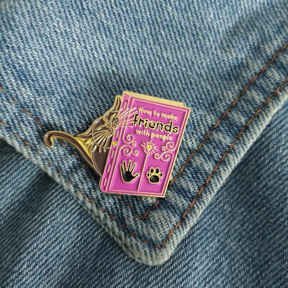 Cat How to Make Friends with People Handbook Enamel Pin